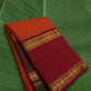 Radiant orange Kanchipuram silk saree with Ganga Jamuna border and traditional gold zari