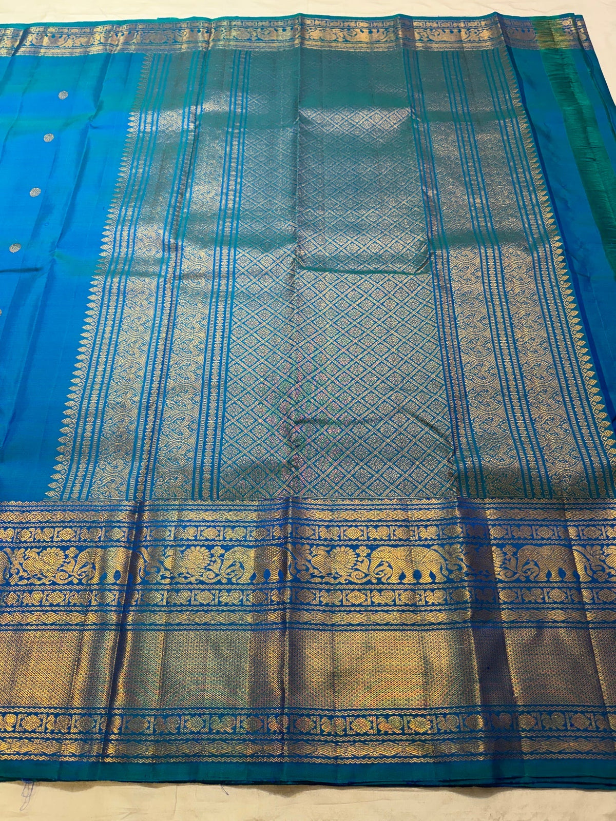 Radiant Peacock Blue handwoven pure silk Kanjivaram Varisaipet saree.