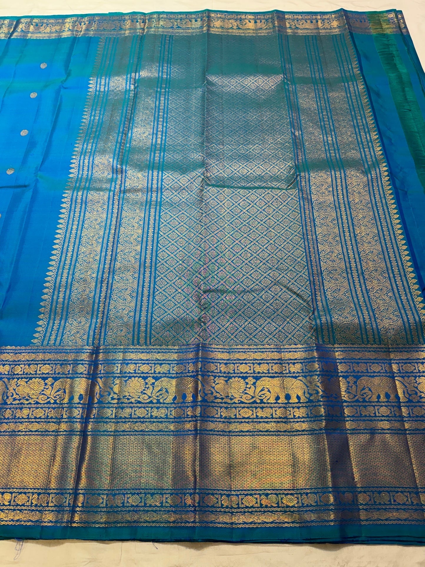 Radiant Peacock Blue handwoven pure silk Kanjivaram Varisaipet saree.