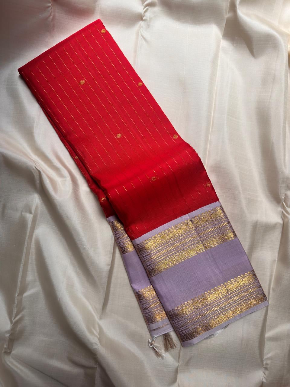 Radiant red Kanjeevaram silk saree with pale lavender Rettapet zari border, full view