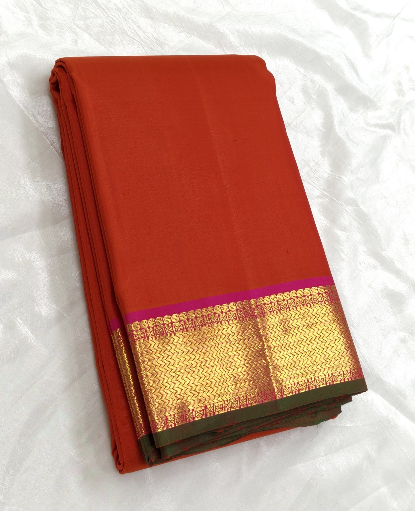 Radiant red orange pure silk Kanchipuram saree with korvai border – drape detail