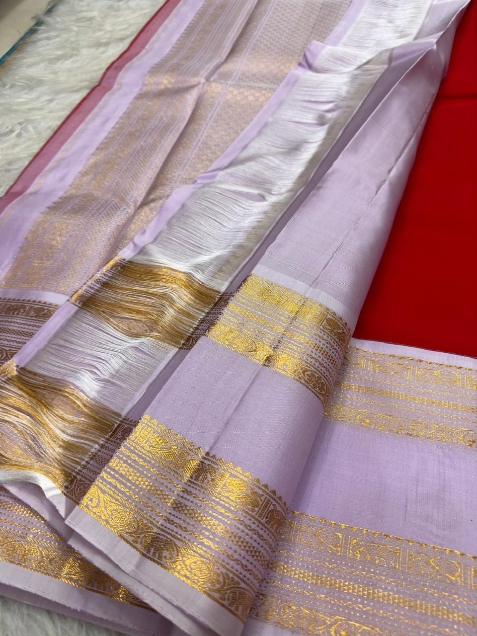 Radiant red silk body with fine vertical zari stripes, Kanjeevaram saree body detail