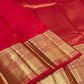 Radiant Vermilion Red pure silk Kanjivaram Butta saree with petite antique-gold zari motifs.