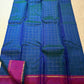 Pure silk Peacock Blue body woven with an evenly ordered antique-gold zari grid