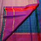 Close view of fine gold Zari Kattam lines crossing the blue silk body
