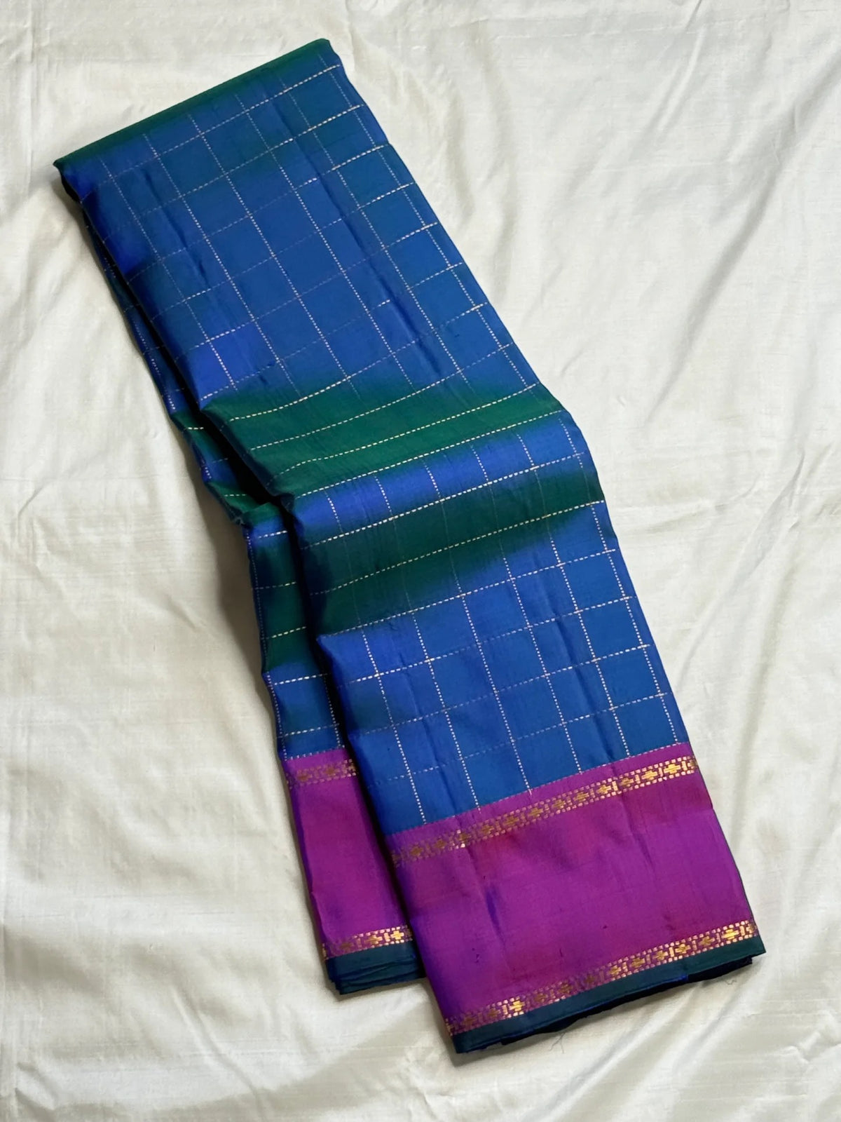 Peacock Blue Zari Kattam Kanchipuram saree with Kathiripoo-purple border