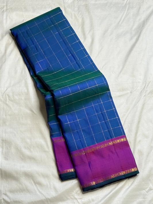 Peacock Blue Zari Kattam Kanchipuram saree with Kathiripoo-purple border