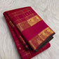 Fine antique-gold Zari Kattam checks woven across the luminous Rani Magenta Kanjivaram silk body.