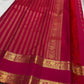 Tiny individual gold zari buttas positioned within the checked Rani Magenta pure silk body.