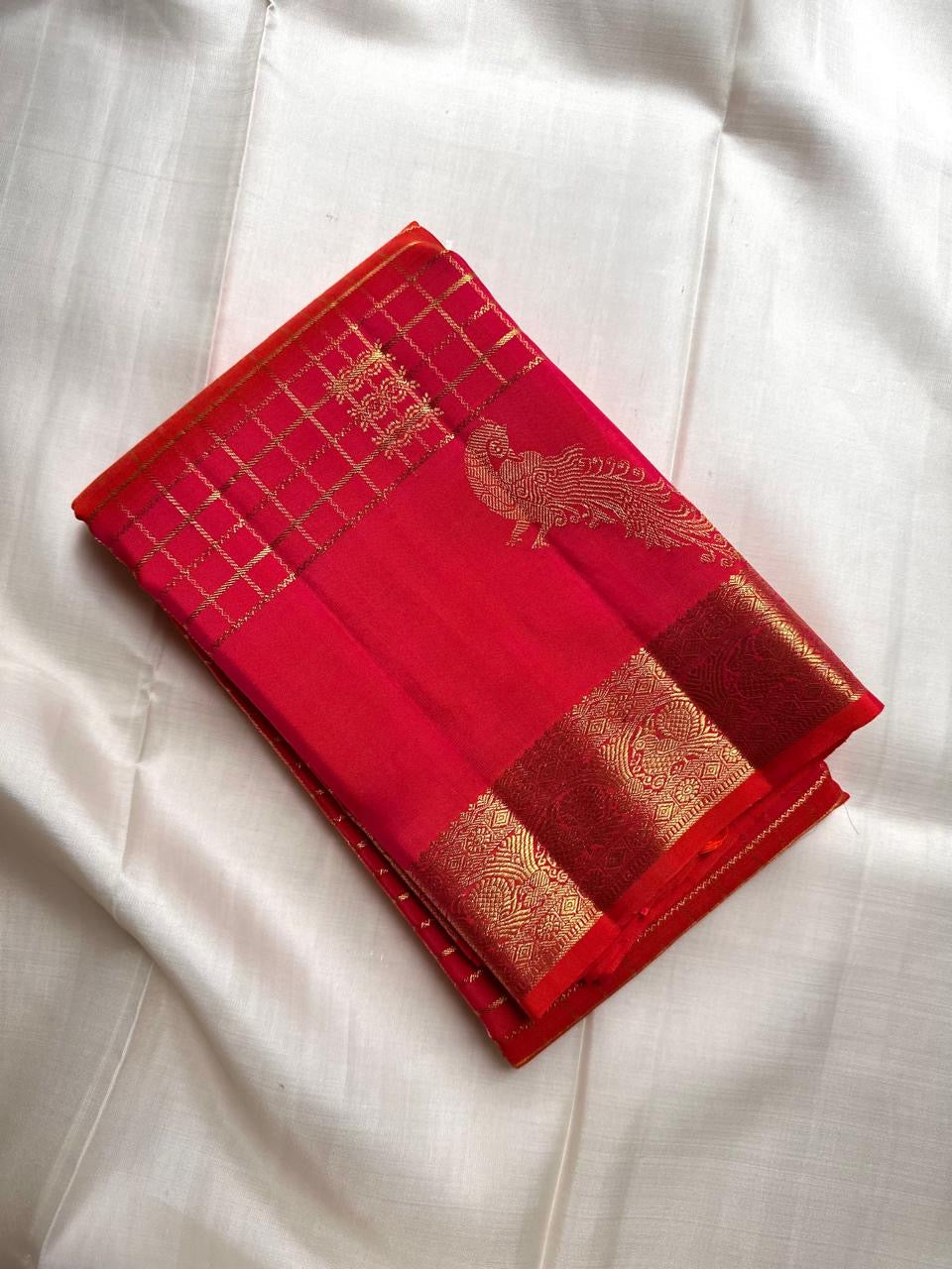 Chilli Reddish Pink Kanchipuram silk saree with antique-gold woven detailing.