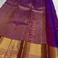 Pink pure silk Kanjivaram Butta saree with broad antique-gold zari border.