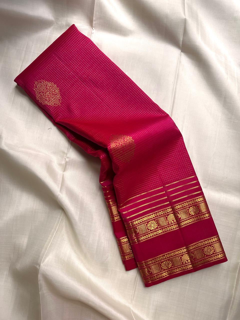 Pomegranate Pink Kanchipuram silk saree with fine antique-gold Zari Kattam check pattern.