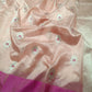 Close-up of the Rani Pink contrast border on a Blush Peach Pattu Silk Chanderi saree