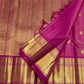 Broad gold zari border detail framed by the vivid Rani Pink silk body.