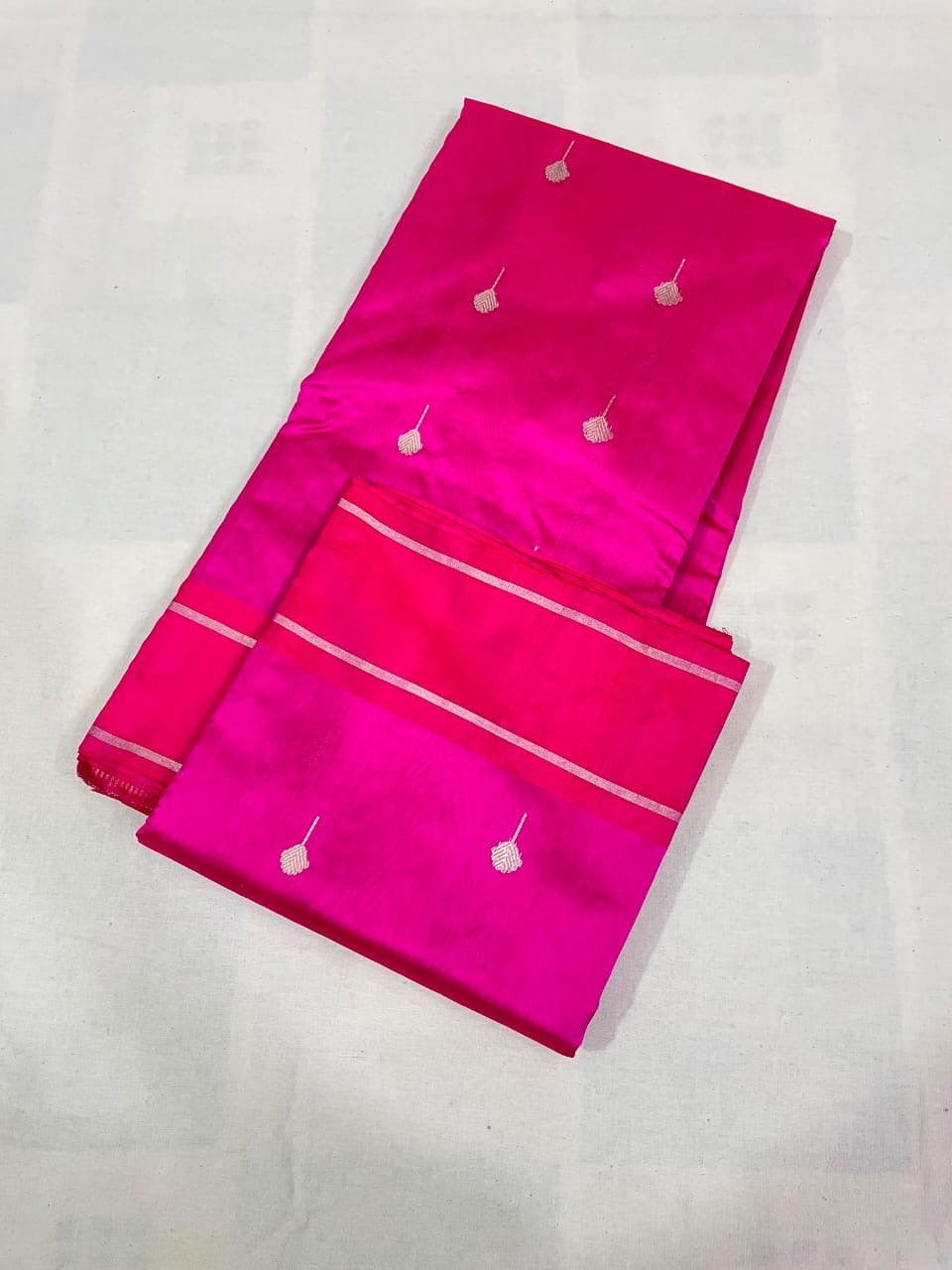 Close-up of a zari butta motif on Rani pink Pattu Silk Chanderi saree