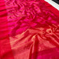 Folded Rani Pink handloom Tissue Silk Chanderi showing linear jari weaving, petite gold buttas and painted border accents