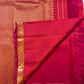 Rani Pink and coral-orange Kanjivaram saree folded with petite gold buttas and zari border