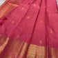 Close view of fine antique-gold checked Zari Kattam woven across Rani Pink pure silk.