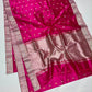 Rani Pink Pattu Silk Chanderi saree detail with gold leaf-shaped buttas catching the light.