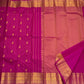 Close-up of the gold medallion border on the Rani pink Kanchipuram silk saree