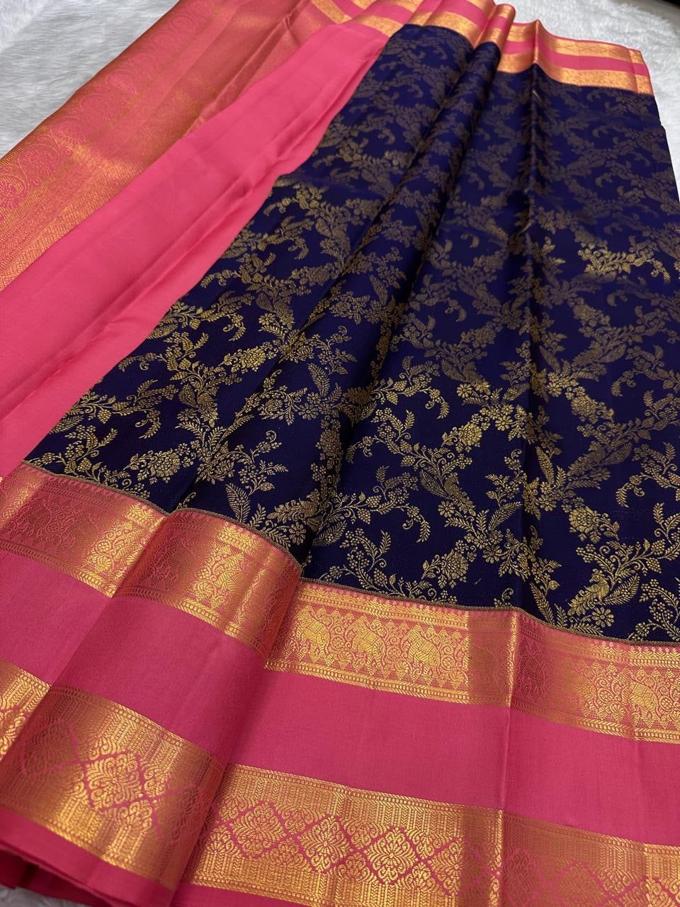 Rani Pink Rettapet Kanchipuram border with layered Reku-style bands and ornamental classic gold zari panels.