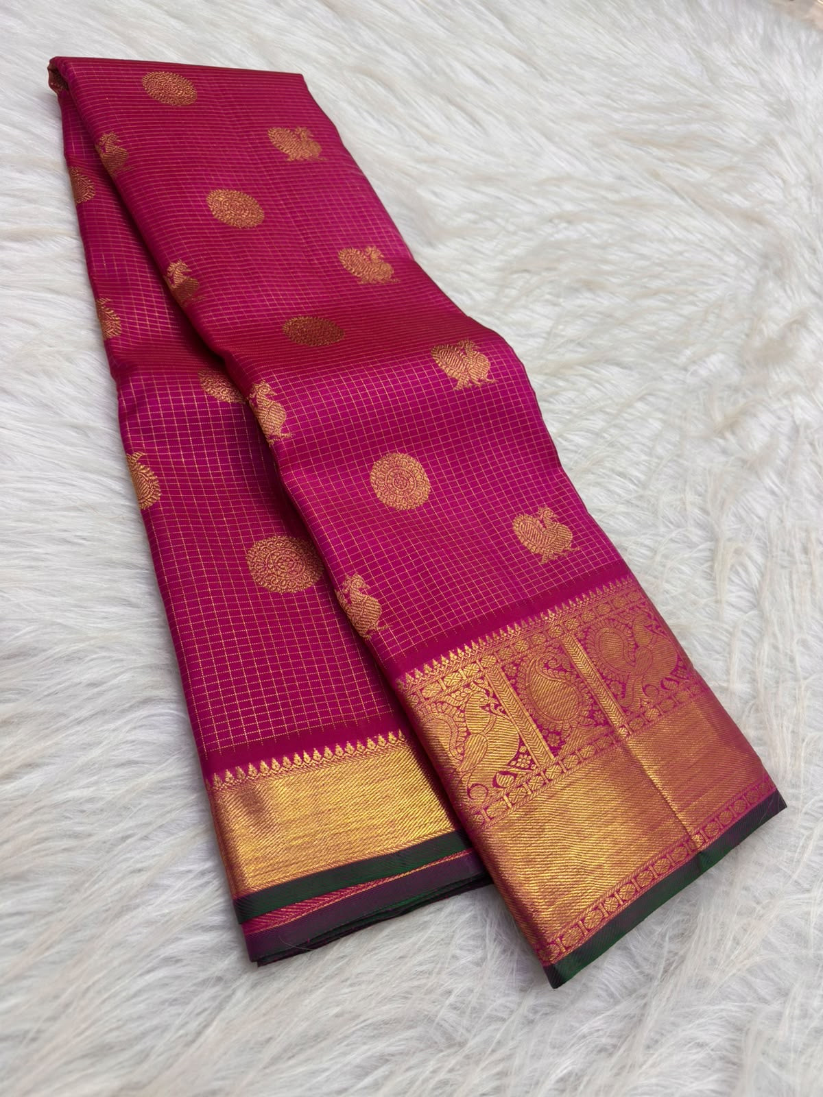 Deep Gulabi silk body with a delicate classic-gold micro-grid, round floral medallions and smaller zari buttas.