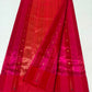 Detail of petite gold buttas along the fine jari stripes on a Rani Pink Tissue Silk Chanderi saree