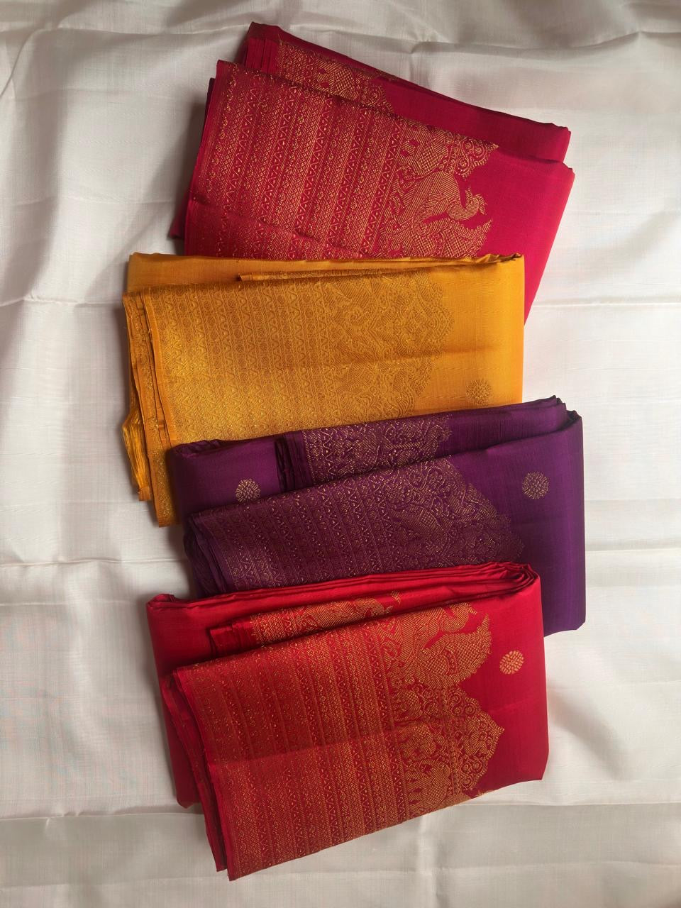 Rani pink Kanjivaram Butta silk saree — zari butta motif close-up