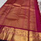 Rani Pink Pure Silk Kanchipuram with fine gold Zari Kattam, Chakram buttas and broad Maanga zari border.