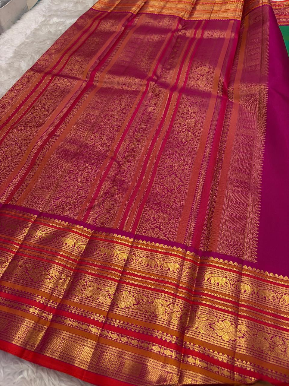 Kanchipattu silk saree in peacock teal with rani pink border Korvai Varisaipet weave traditional zari detail