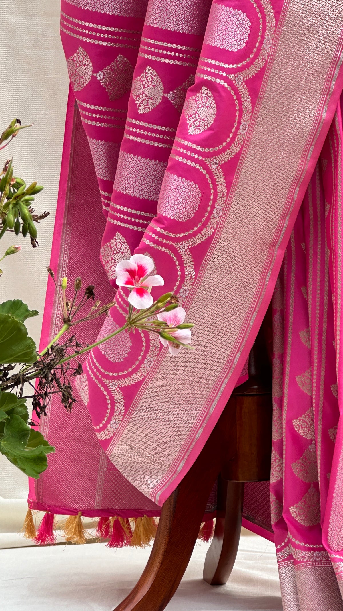 Close view of zari buttas on pink Pure Katan Silk Banarasi saree