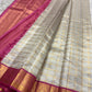 Rani Pink Korvai border with rich gold zari on Ivory Kora silk.