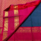 Rani Pink Korvai border with warm gold zari registers on Peacock Blue Rettapet Kanchipuram saree.