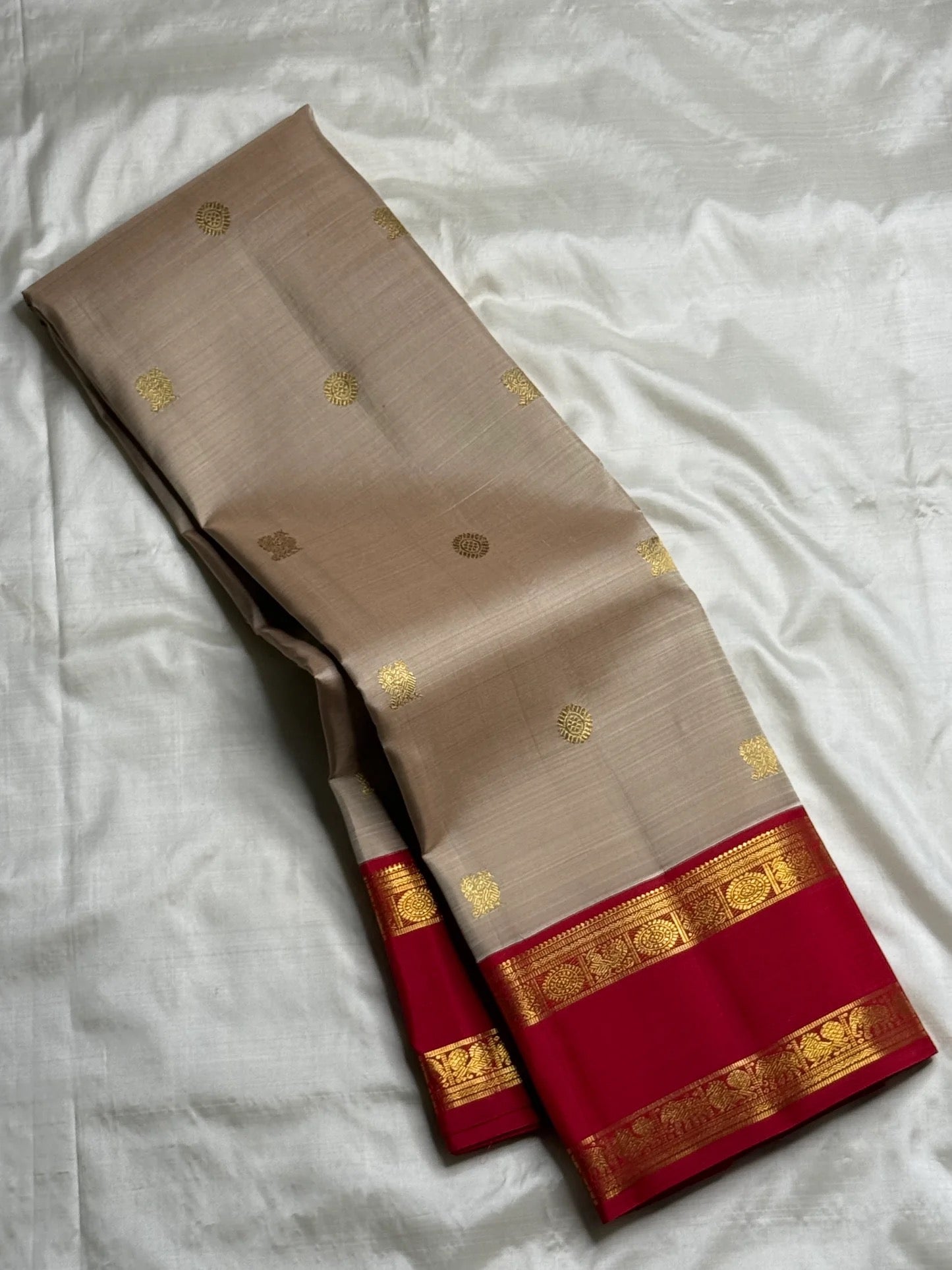 Close view of the lower rani pink border with ornamental gold zari bands
