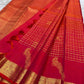 Traditional Mayil peacock border in antique gold on Chilli Reddish Pink Kanjivaram saree.