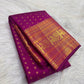 Broad Mayil gold zari border on Rani Pink Kanjeevaram Butta saree.
