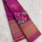 Close view of multicolour woven floral jaal with large blossoms and curling stems on pink silk.