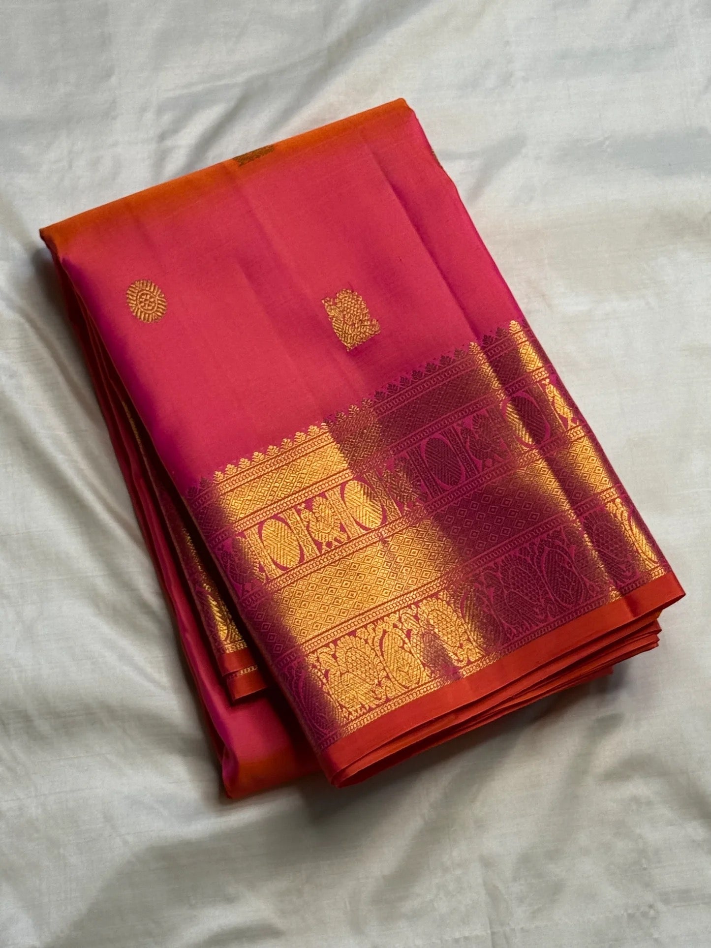 Rani Pink and Vermilion Orange Shot-Colour Handwoven Pure Silk Kanchipuram Saree with Gold Zari Buttas