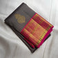 Close view of vibrant Rani Pink Kanchipuram Korvai border and pallu with luminous gold zari detailing.