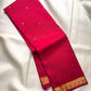 Handwoven Pure Silk Kancheepuram Butta saree with an open red body and small gold zari motifs.