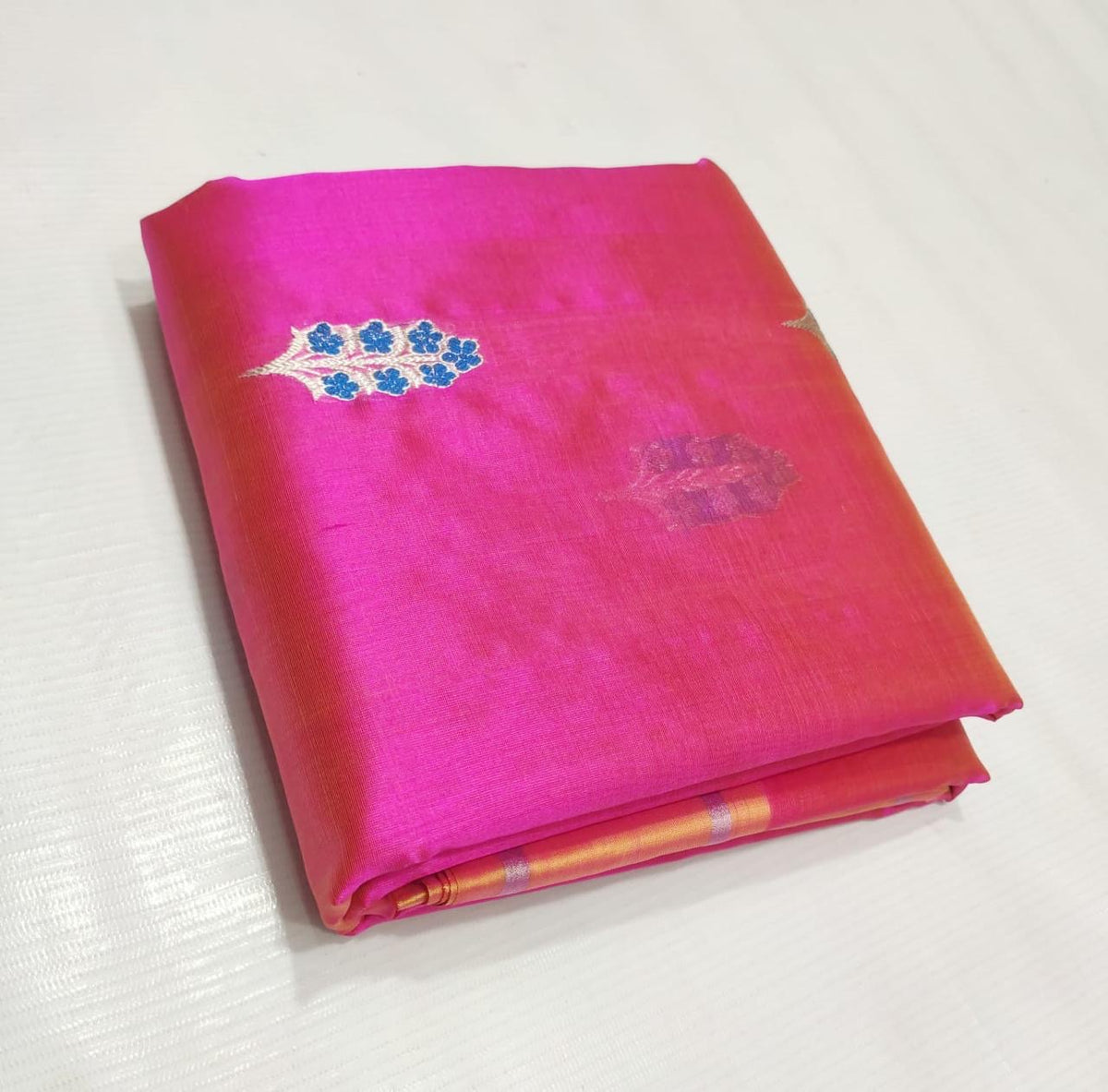 Rani pink handwoven Pure Silk Chanderi saree with blue floral buttas