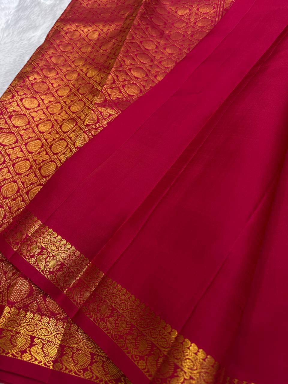 Sindoor Red Pure Silk Kancheepuram saree with small gold zari buttas and a richly woven tonal gold zari border.