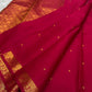 Tonal deep-red Kancheepuram border with repeated bird-and-floral classic-gold zari ornament.