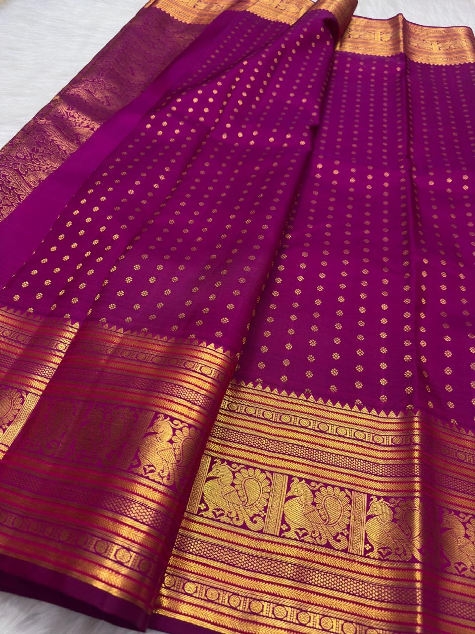 Rani Pink Kanchipuram silk saree with petite gold buttas arranged in precise vertical rows.