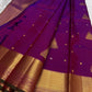Handwoven Rani Pink Kanchipuram silk saree with antique-gold zari and Deep Green selvedge.