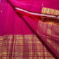 Bright raspberry pink Kanchipuram Varisaipet saree with handwoven antique-gold body motifs.