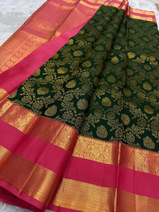 Rani Pink Kanchipuram mundhanai densely woven with geometric lattice, floral medallions and gold zari.