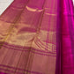 Jewel-toned Rani Pink pure silk saree with intricate handwoven floral zari coloration.