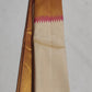 Antique-gold zari border with Rani Pink temple-style transition on ivory Kanjivaram silk.