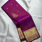 Rani Pink pure silk Kanjivaram Butta saree with traditional Thazhampoo Reku zari motifs.